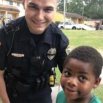 A child dials 911 seeking assistance from police officer.