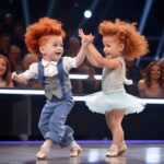 A boy and a girl enter the dance floor under “Footloose” and circle the judges’ heads.